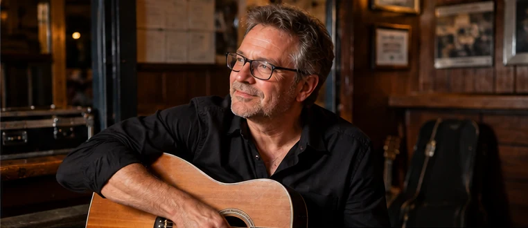 Acoustic guitarist in a relaxed music setting